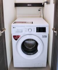 Compact laundry area with washing machine