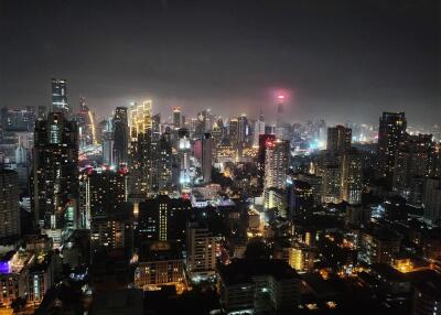 Night view of city skyline with illuminated buildings