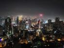 Night view of city skyline with illuminated buildings