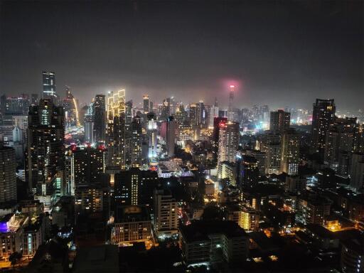 Night view of city skyline with illuminated buildings