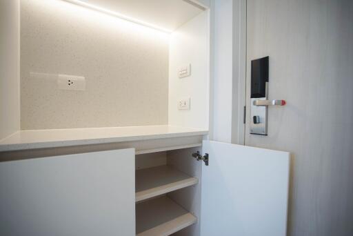 Open storage cabinet with shelves and light