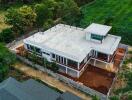 Aerial view of modern building surrounded by greenery