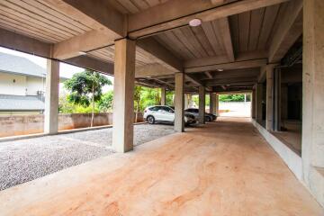 Secure parking area under building with multiple car spots