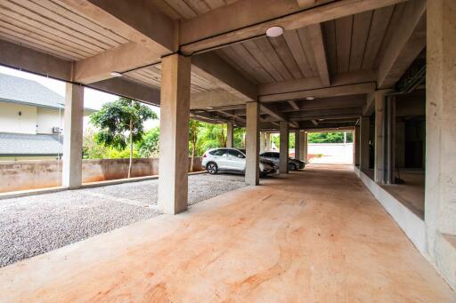 Secure parking area under building with multiple car spots