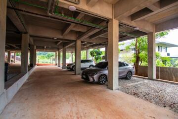 Covered parking area with multiple cars