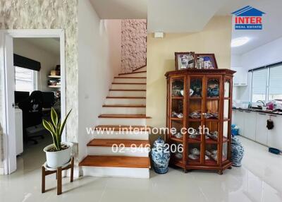 Main living area with stairs and decor