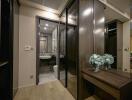 Modern bathroom view with wooden accents and decorative flowers