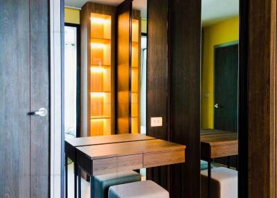 Modern bedroom with vanity area and mirrored closet doors