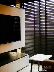 Living room with TV and blinds