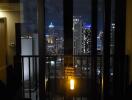 Night view of a city's skyline from a balcony