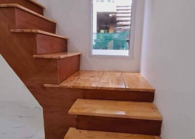 Wooden staircase with window