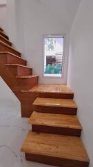 Wooden staircase with window