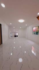 spacious main living area with marble floor and ample lighting