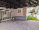 Spacious garage area with tiled flooring and attached garden