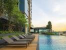 Outdoor swimming pool area with lounge chairs