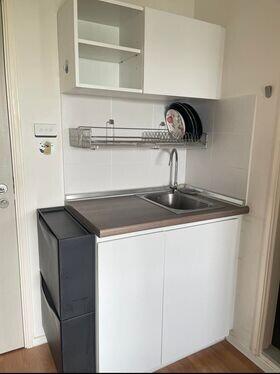 Compact kitchen space with sink and storage