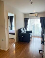 modern living room with hardwood floor and large window