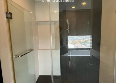 Glass shower enclosure with city view