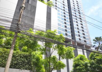 High-rise residential building with greenery