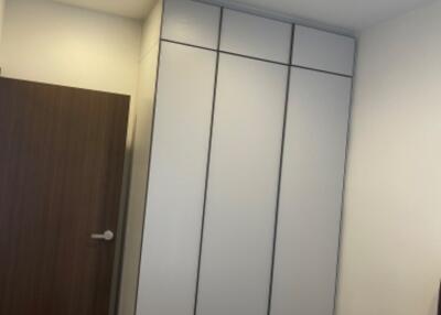 Bedroom with closet and door