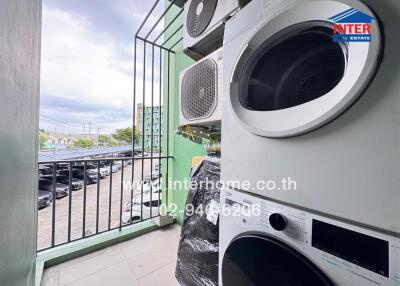 Balcony with washing machine and air conditioning units