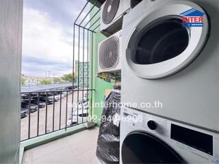 Balcony with washing machine and air conditioning units