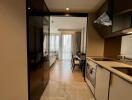 Modern kitchen area leading to a living room