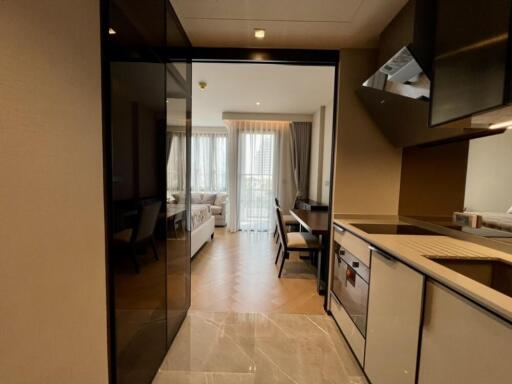 Modern kitchen area leading to a living room