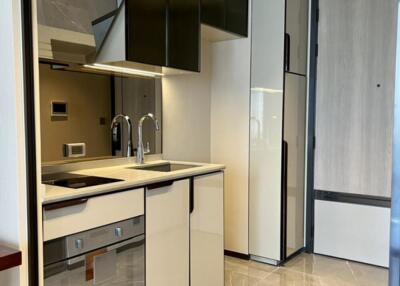 Modern kitchen with sleek cabinetry and built-in appliances