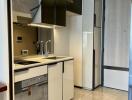 Modern kitchen with sleek cabinetry and built-in appliances