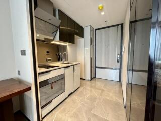 Modern kitchen with sleek cabinetry and built-in appliances