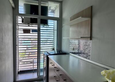 Small modern kitchen with outdoor view