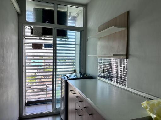 Small modern kitchen with outdoor view