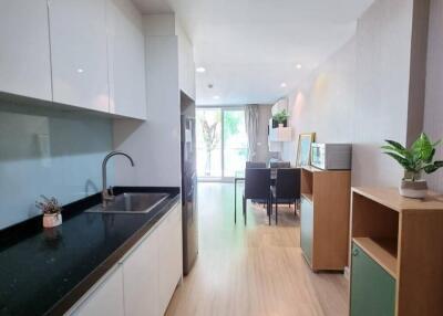 Modern kitchen with dining area and natural light