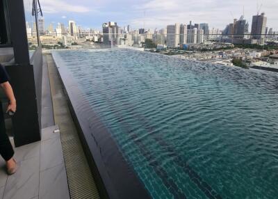 Rooftop infinity pool with city skyline view