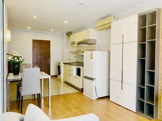 Modern open-plan living area with kitchen and dining table