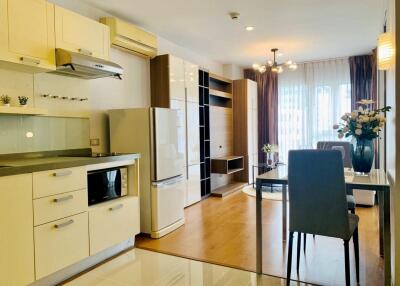 Modern kitchen and living area with natural light