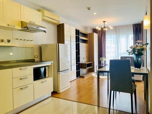 Modern kitchen and living area with natural light