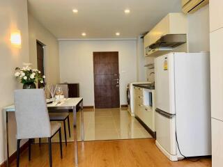 Modern kitchen and dining area with appliances