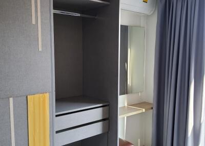 Bedroom with wardrobe and vanity