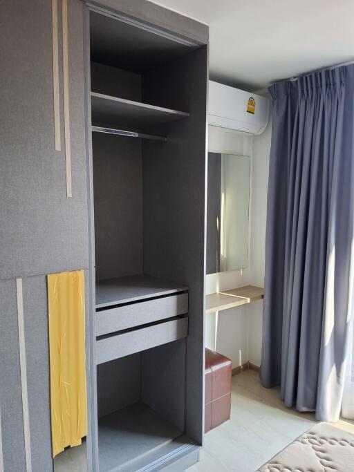 Bedroom with wardrobe and vanity