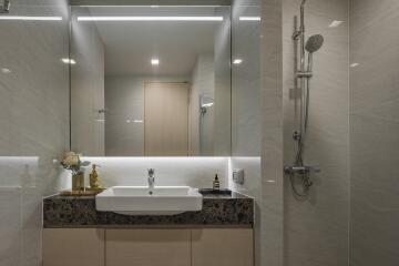 Modern bathroom with large mirror and shower