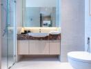 Modern-bathroom-with-glass-shower-door-and-sleek-sink