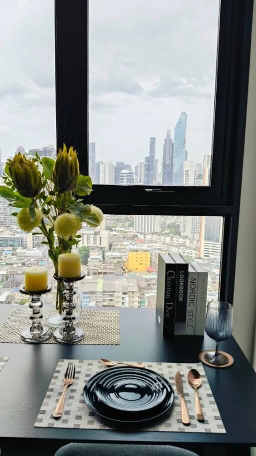 A modern dining area with a cityscape view