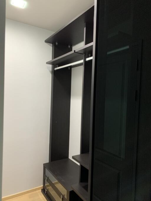 Walk-in closet with shelves and drawers