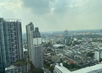 Aerial view of cityscape with tall buildings and residential area