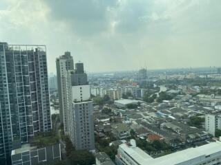 Aerial view of cityscape with tall buildings and residential area