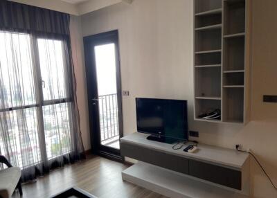 Modern living room with shelves and TV