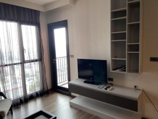 Modern living room with shelves and TV