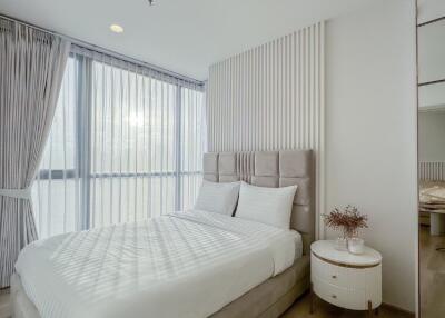 modern bedroom with large windows and natural light